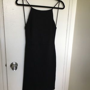 Dress: form fitting, classy knee length, backless